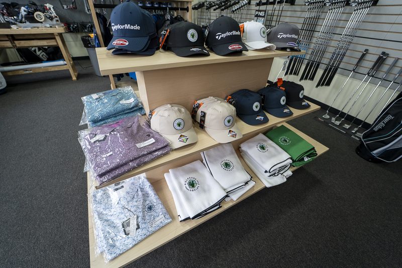 Pro shop hats, polos, and towels display